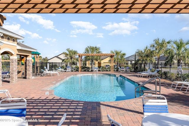 view of swimming pool with a pergola and a patio