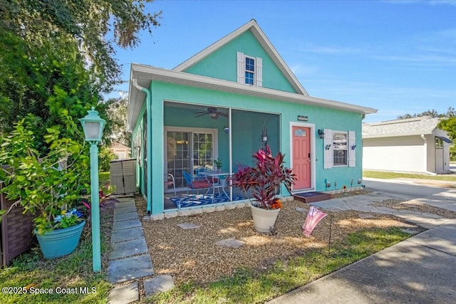 bungalow-style home with ceiling fan and covered porch