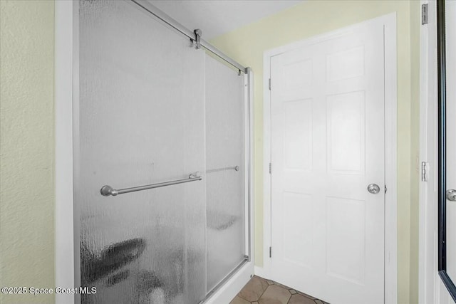 bathroom featuring tile patterned floors and walk in shower