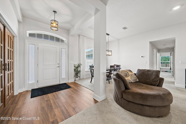 entryway with wood-type flooring