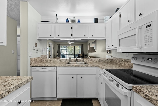 kitchen featuring white cabinetry, sink, white appliances, and ceiling fan