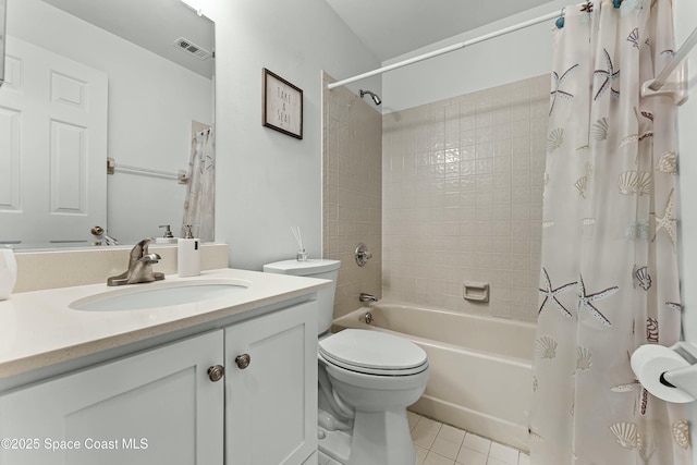 full bathroom featuring tile patterned flooring, vanity, toilet, and shower / bathtub combination with curtain