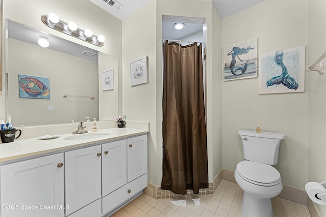 bathroom featuring vanity, curtained shower, tile patterned floors, and toilet