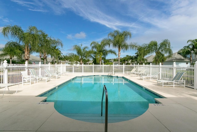 view of swimming pool with a patio area