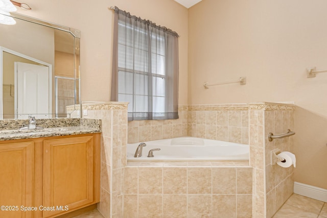 bathroom with vanity, tile patterned floors, and plus walk in shower