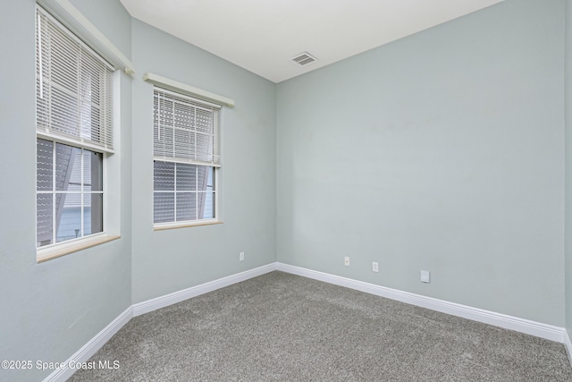 spare room featuring carpet flooring