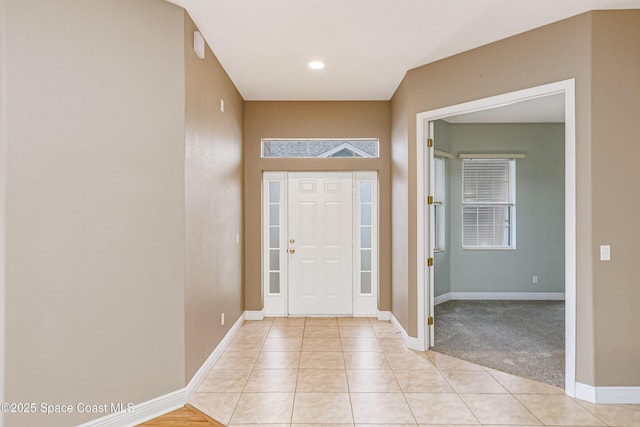 entryway featuring light tile patterned floors