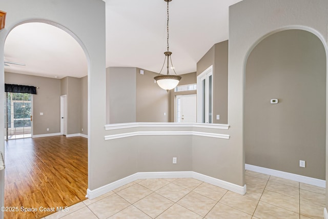 empty room with light tile patterned floors