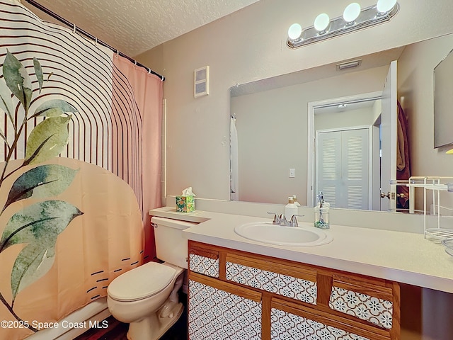 bathroom with vanity, toilet, a textured ceiling, and a shower with shower curtain