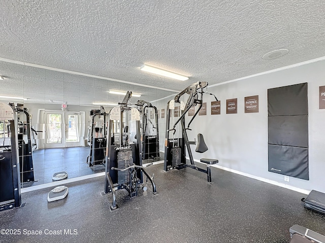 gym with crown molding and a textured ceiling