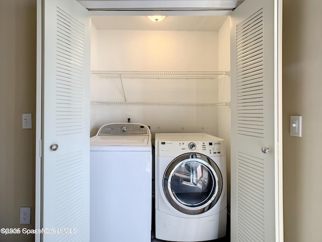 washroom with washing machine and dryer