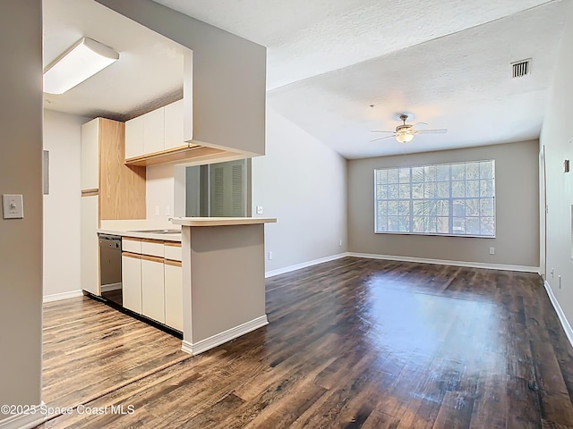 7667 N Wickham Rd Unit 721, Melbourne, FL 32940 - kitchen with ceiling fan, dark wood-style flooring, stainless steel dishwasher, light countertops, and baseboards