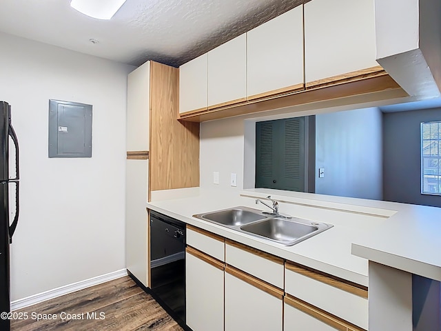 7667 N Wickham Rd Unit 721, Melbourne, FL 32940 - kitchen with dark wood-style floors, light countertops, electric panel, a sink, and black appliances
