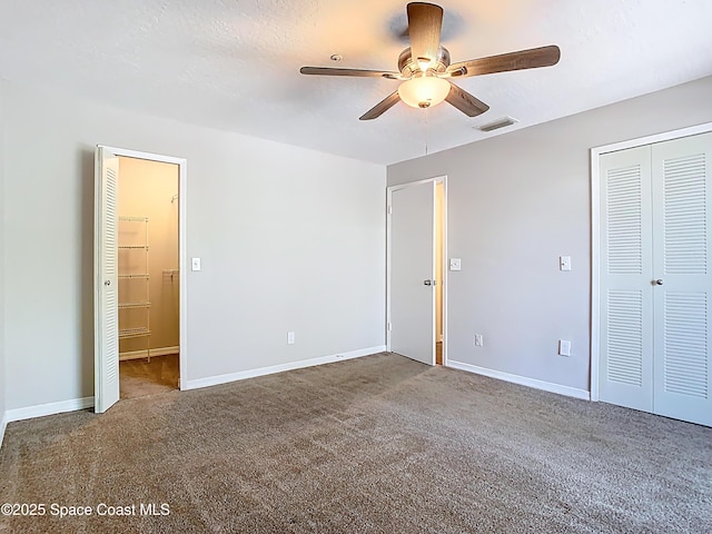 7667 N Wickham Rd Unit 721, Melbourne, FL 32940 - unfurnished bedroom with carpet floors, baseboards, visible vents, and a closet