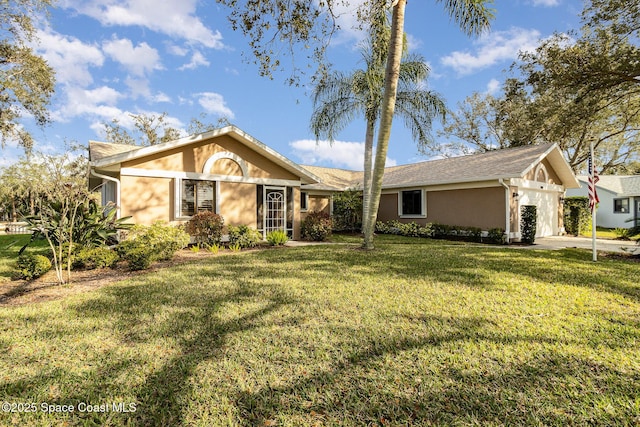 ranch-style house with a garage and a front lawn