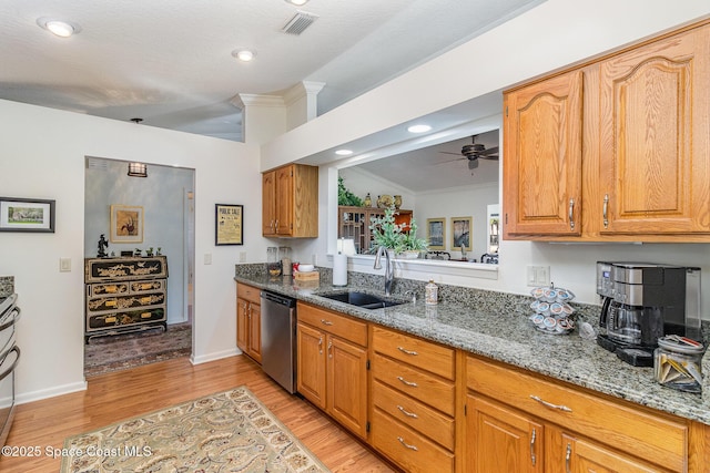 kitchen featuring sink, crown molding, stone counters, stainless steel dishwasher, and light wood-type flooring