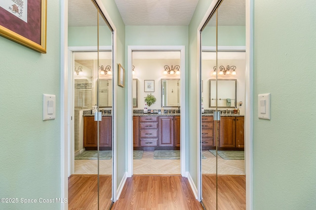 bathroom featuring vanity and wood-type flooring