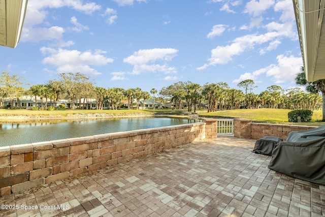 view of patio / terrace featuring a water view