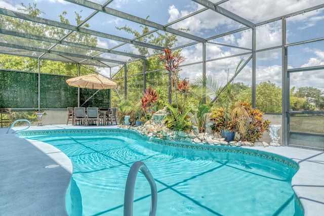 view of pool with a lanai and a patio