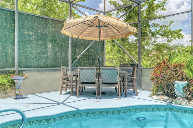 view of swimming pool with a lanai and a patio area