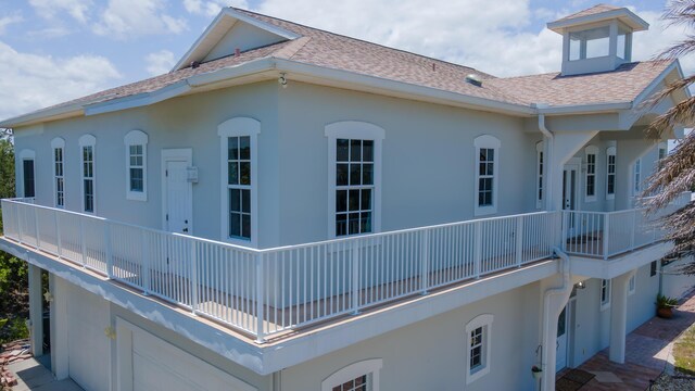 view of property exterior featuring a balcony