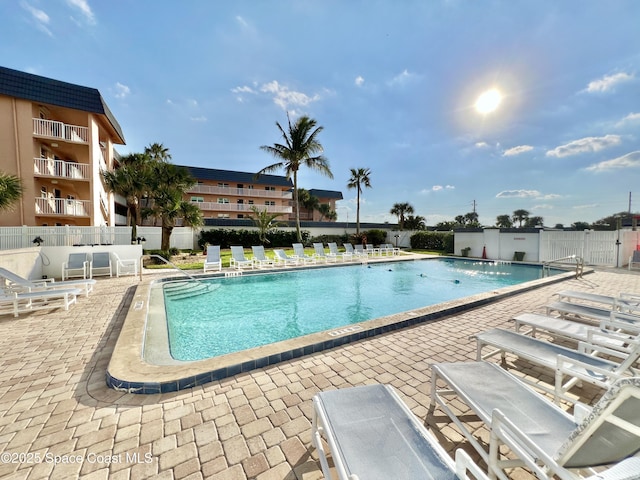 view of swimming pool featuring a patio area