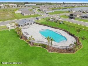 2472 Carrick St NW, Palm Bay, FL 32907 - view of pool featuring a lawn
