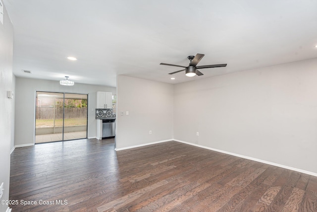 unfurnished living room with ceiling fan and dark hardwood / wood-style flooring