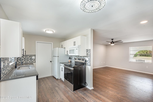 kitchen featuring sink, white cabinetry, tasteful backsplash, dark hardwood / wood-style floors, and white appliances