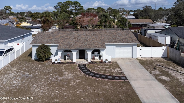 view of front of house featuring a garage and covered porch