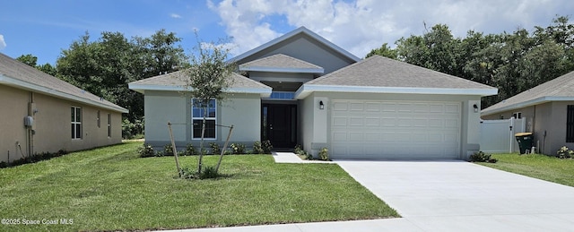 view of front of property featuring a garage and a front lawn