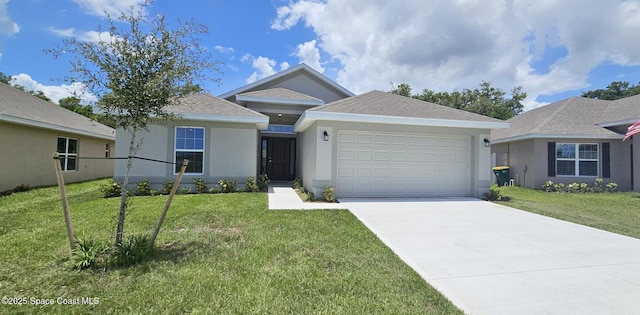 view of front of house featuring a garage and a front yard