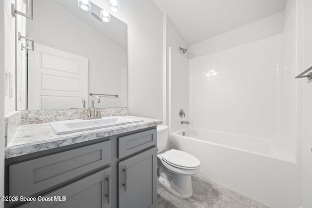 full bathroom with bathtub / shower combination, vanity, toilet, and a textured ceiling