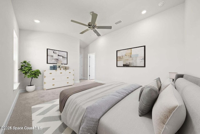 bedroom featuring vaulted ceiling, light colored carpet, and ceiling fan