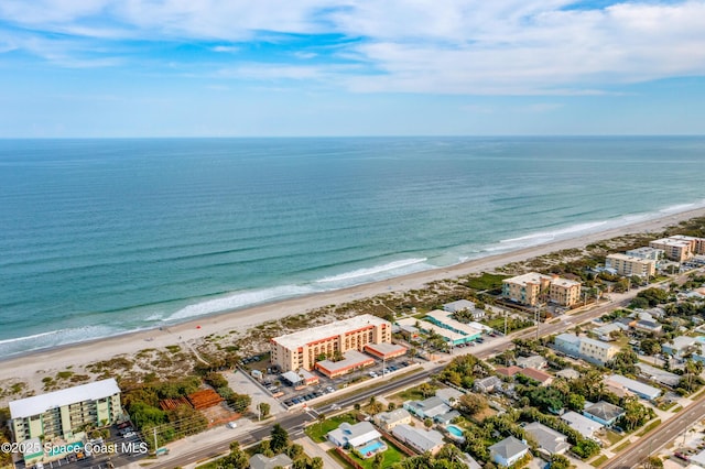 aerial view featuring a water view and a view of the beach