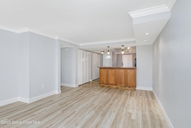 unfurnished living room featuring crown molding and light hardwood / wood-style flooring