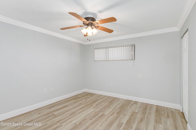 spare room featuring crown molding, light hardwood / wood-style flooring, and ceiling fan