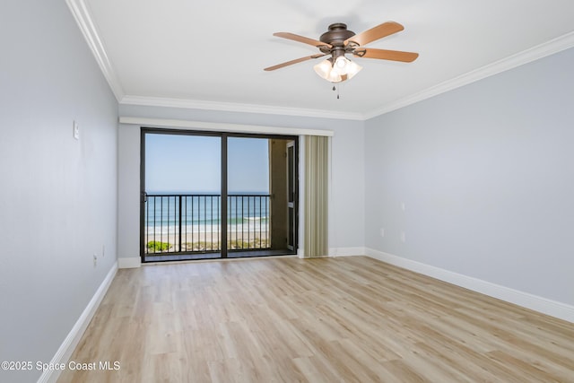 empty room with ornamental molding, ceiling fan, and light hardwood / wood-style floors