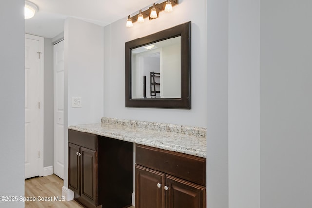 bathroom with vanity and hardwood / wood-style floors