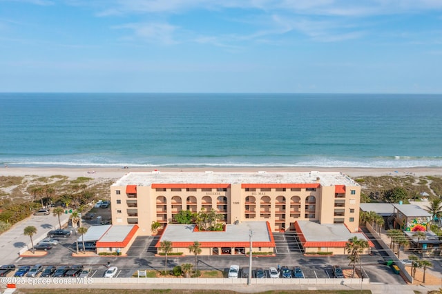 aerial view featuring a view of the beach and a water view