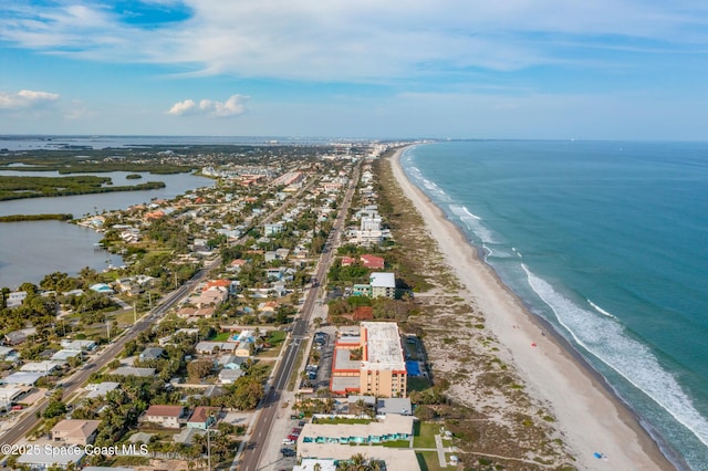 birds eye view of property featuring a view of the beach and a water view