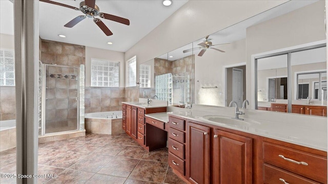 full bath featuring two vanities, a sink, a bath, and a shower stall