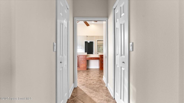 corridor with light tile patterned floors