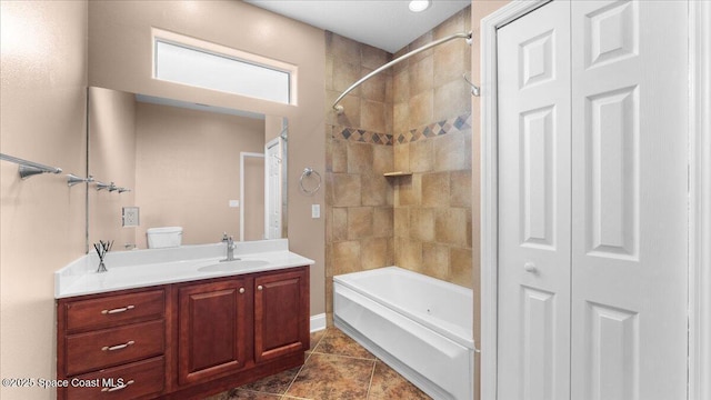 bathroom with tile patterned flooring, shower / washtub combination, a closet, and vanity