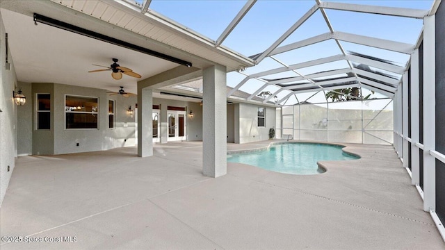 pool with ceiling fan, a patio, and glass enclosure