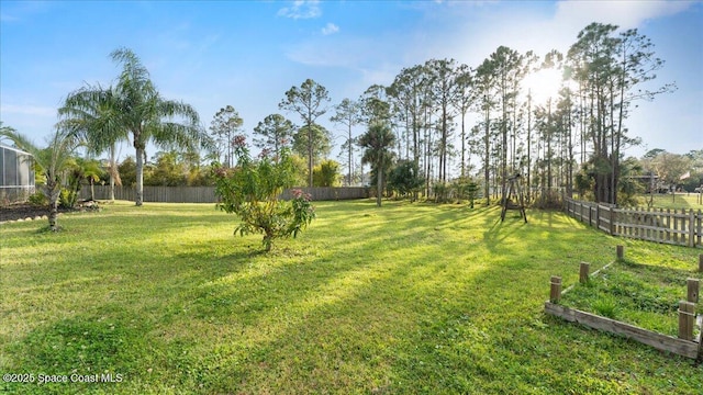 view of yard featuring a fenced backyard and a vegetable garden