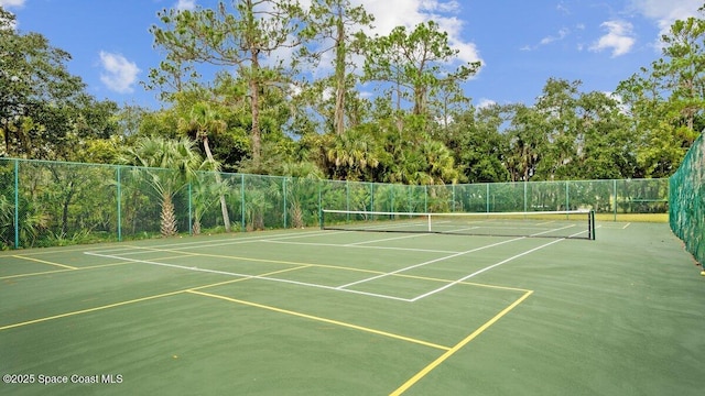 view of sport court featuring fence