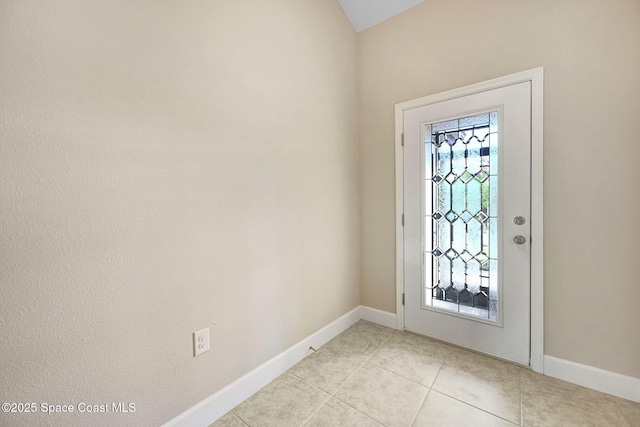 foyer entrance featuring light tile patterned floors