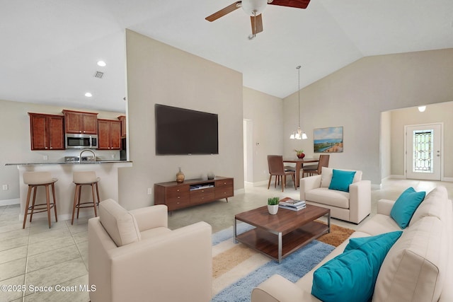 living room featuring high vaulted ceiling, light tile patterned floors, and ceiling fan