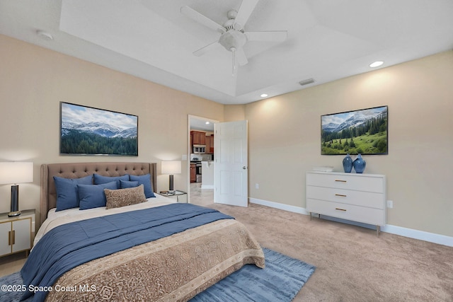 bedroom with ceiling fan and light colored carpet